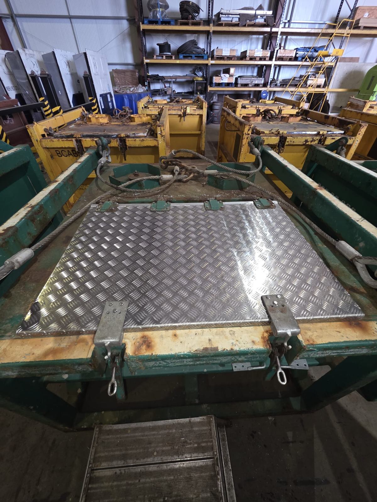 Bespoke aluminium chequer plate cover fabricated and fitted to a steel lifting frame